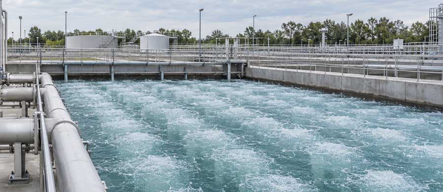 Roots blower aeration system supplying air to a wastewater treatment basin